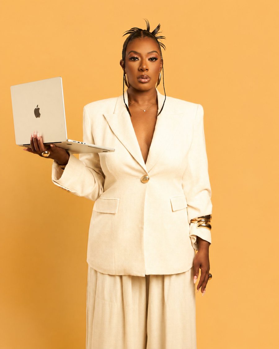 De'Erika Watson holding a laptop